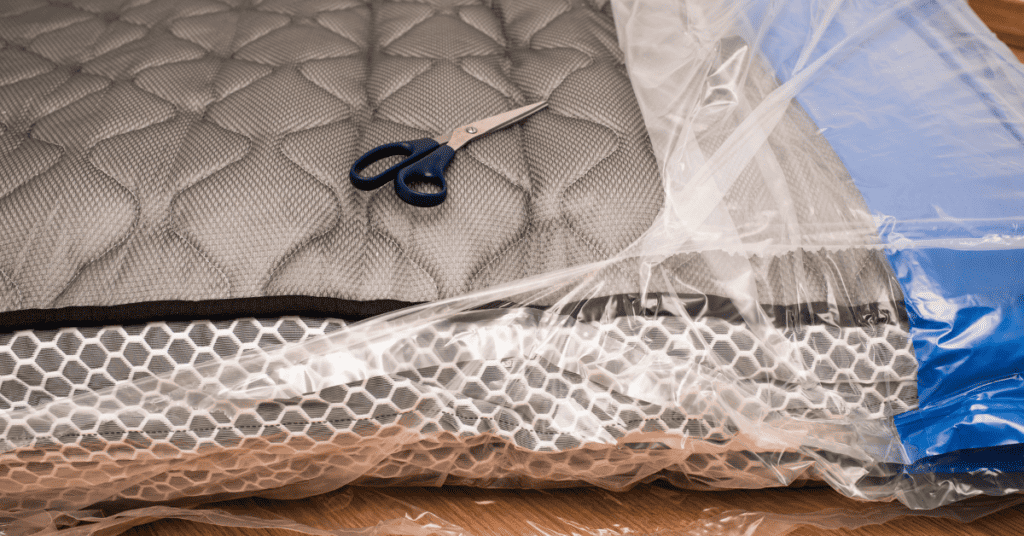 wrap a mattress in plastic before throwing it away